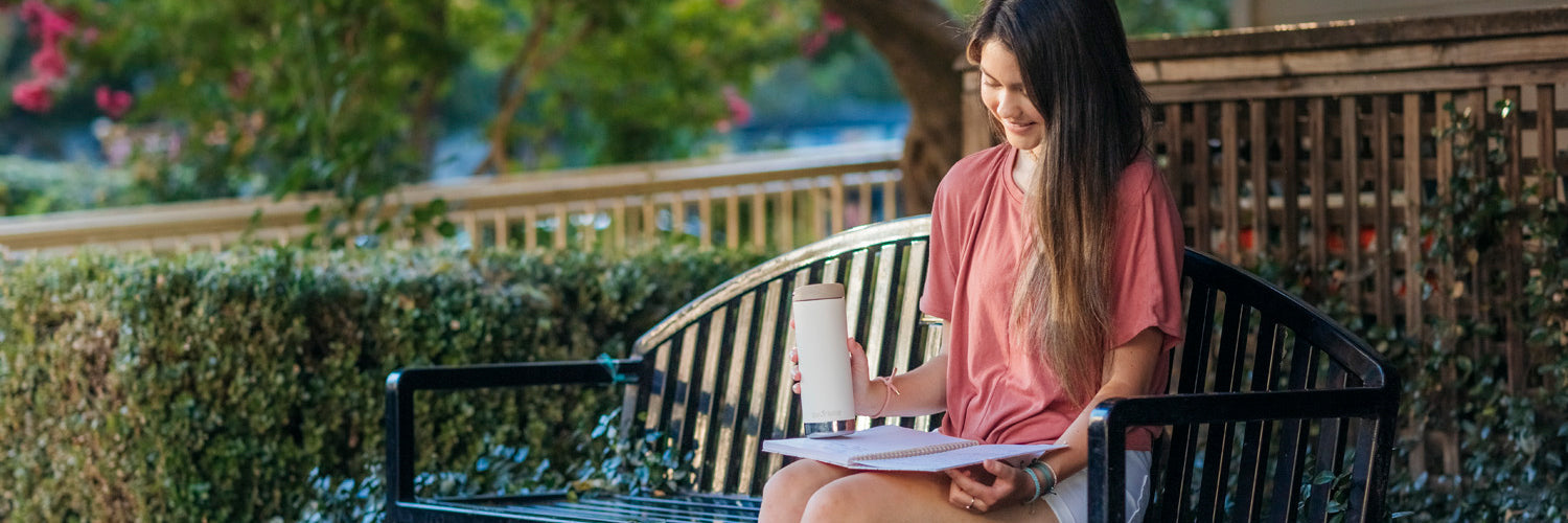 Girl studying with water bottle